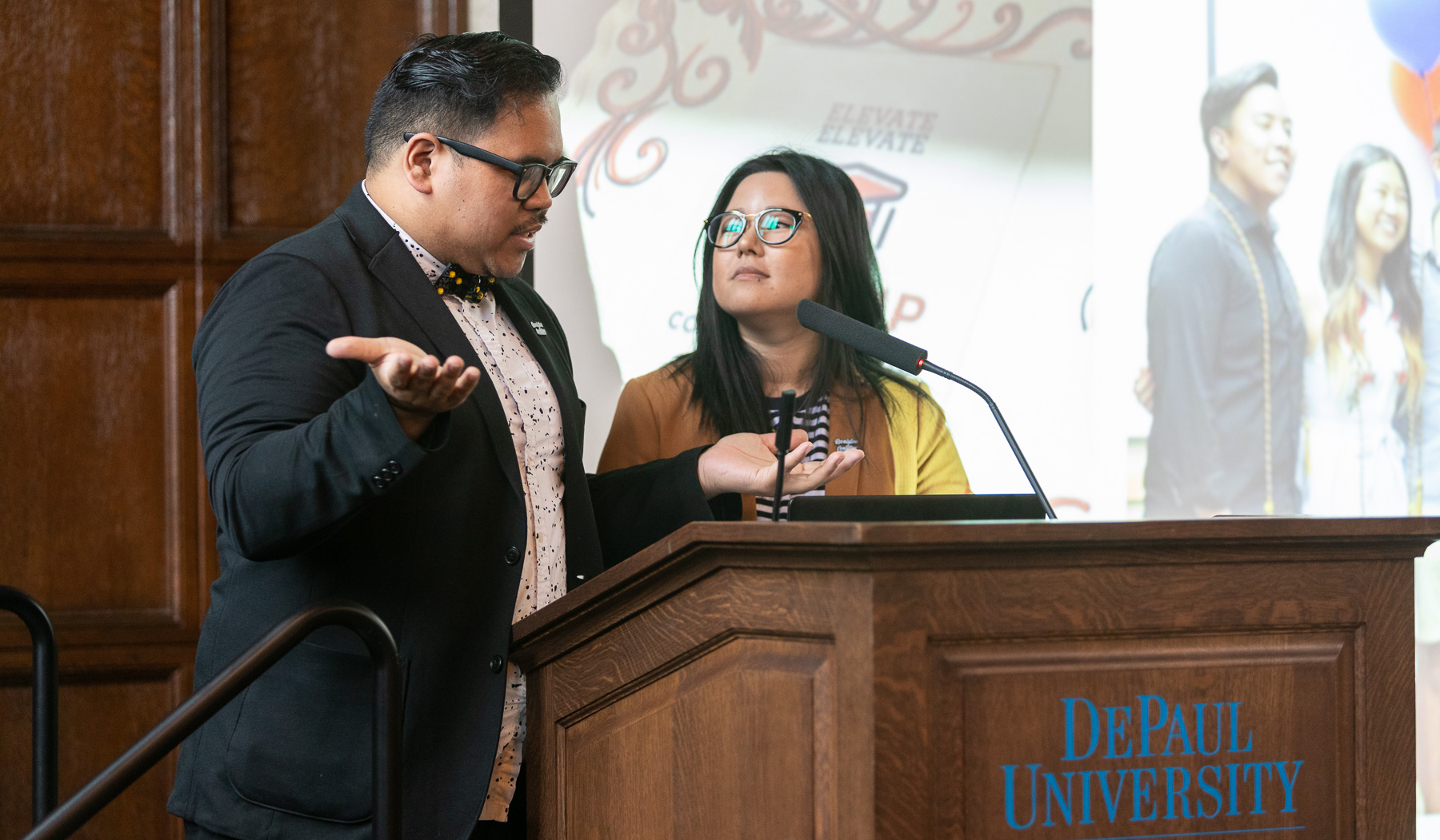 Mark Anthony Florido, assistant director, Identity Conscious Support Programs, left, and Eva Long, Asian Pacific Islander Desi American Cultural Center (APIDA) coordinator, welcomed guests to the second annual event in Cortelyou Commons. (DePaul University/Jeff Carrion)